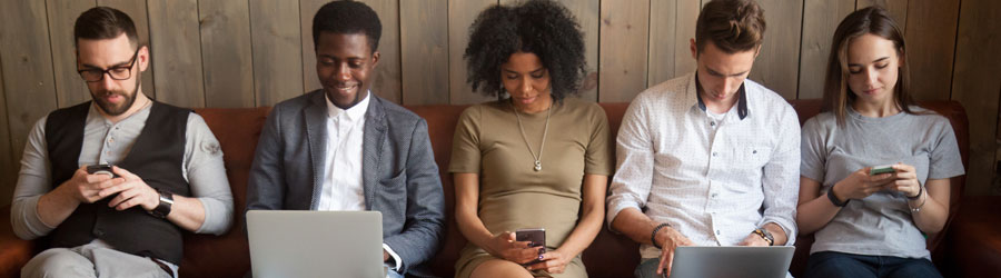 sms-texting-martketing-business-tools-sc Young humans looking at their devices.
